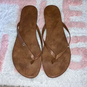 Brown “G” flats